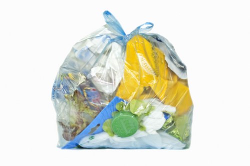 Workers sorting recyclable materials at a local transfer station