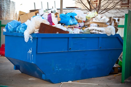 Muck away workers handling waste removal in Surbiton