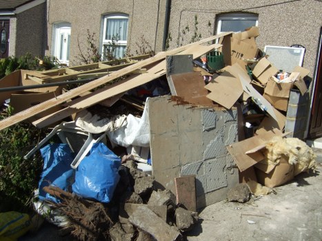 Customer service team assisting with skip hire